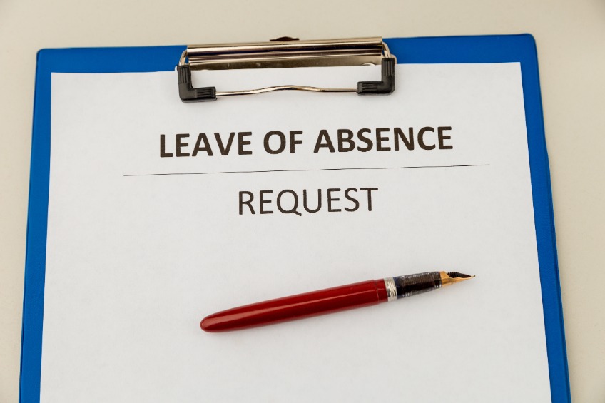 Leave of Absence Request form and pen