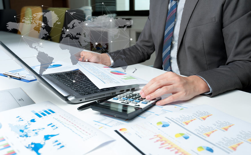 man with graphs and world map